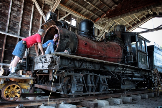 Ron Carter, left, and Jay Matthews discuss the restoration of J. Neils Lumber Co. steam locomotive number 4 on a recent Saturday morning. After being on display for nearly 50 years, the engine built in 1906 by the Lima Locomotive Works is currently being restored to operation. - Justin Franz | Flathead Beacon