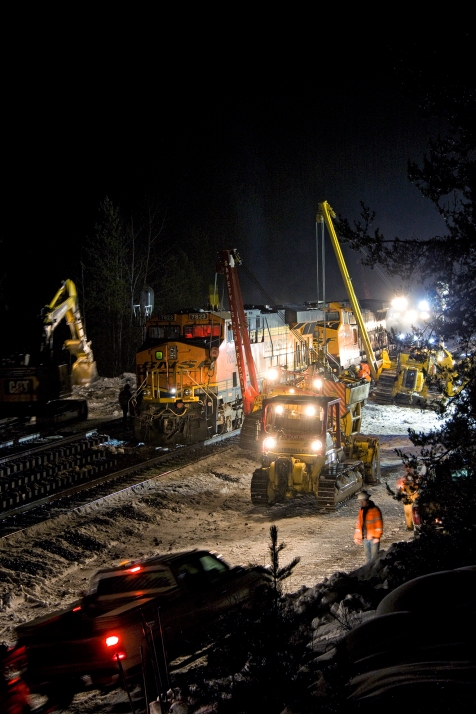 BNSF Railway employees work through the night Friday, after an eastbound freight train derailed near West Glacier early that morning. - Justin Franz | Flathead Beacon